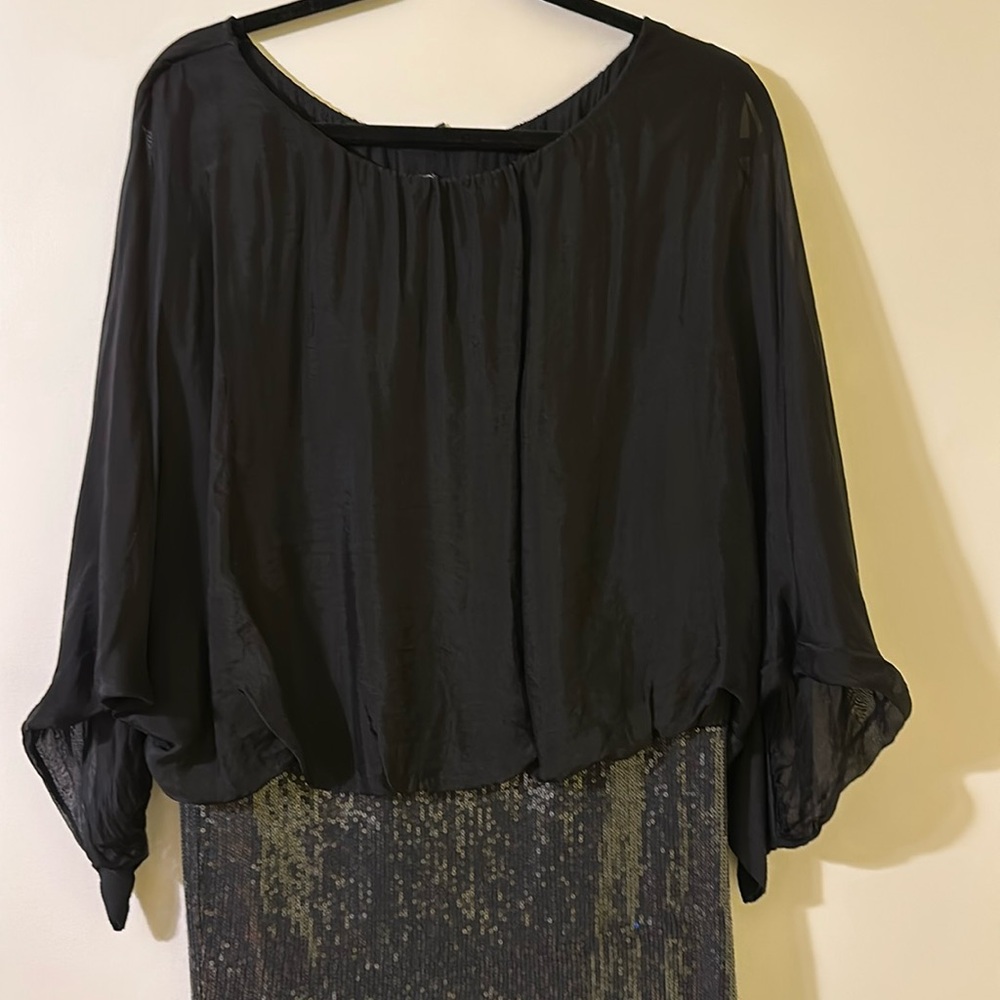 Black silk on top and sequins on the bottom